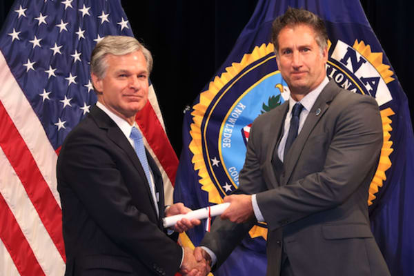 Steve Martingano shakes hands with the FBI Director thumbnail