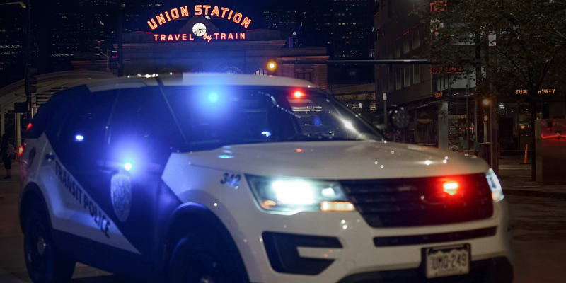 Police vehicle outside Union Station at night