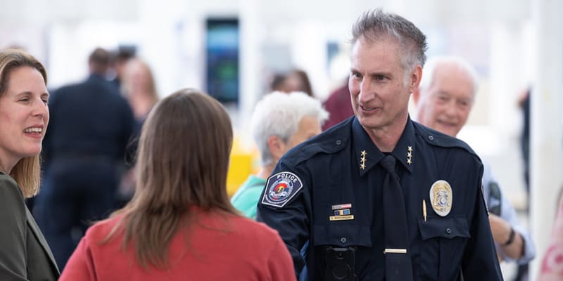 Chief Martingano shaking hands with customer at swearing-in event