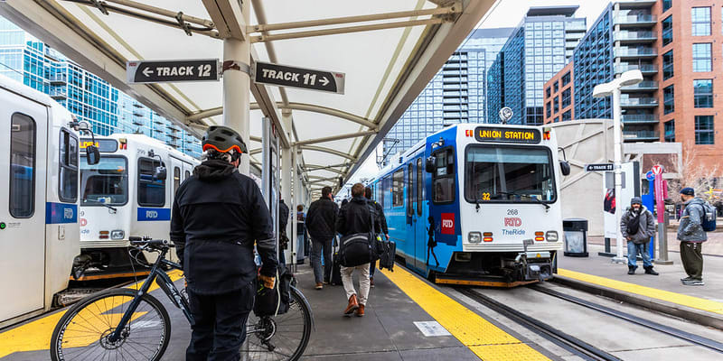 Customers board light rail trains at Denver Union Station