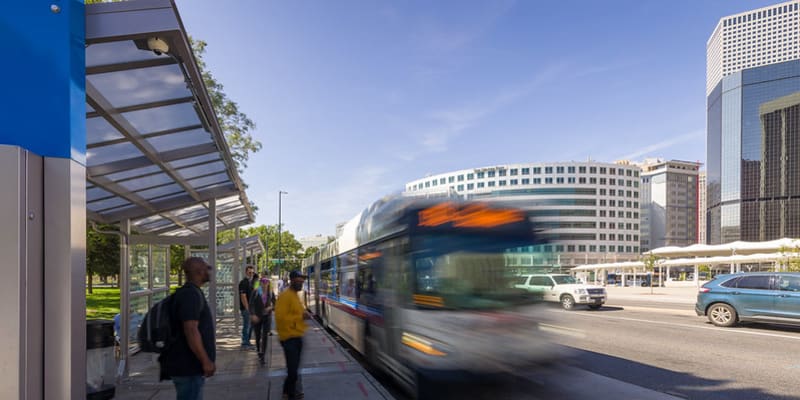Customers boarding bus at Colfax and Lincoln