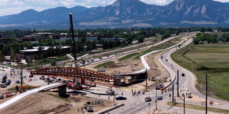 A photo of the 63rd Street bicycle pedestrian bridge being installed as part of the CO 119 Safety, Mobility and Bikeway project
