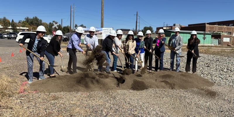 A photo of local officials breaking ground with golden shovels at the site of the future 1st and Main Transit Center in Longmont