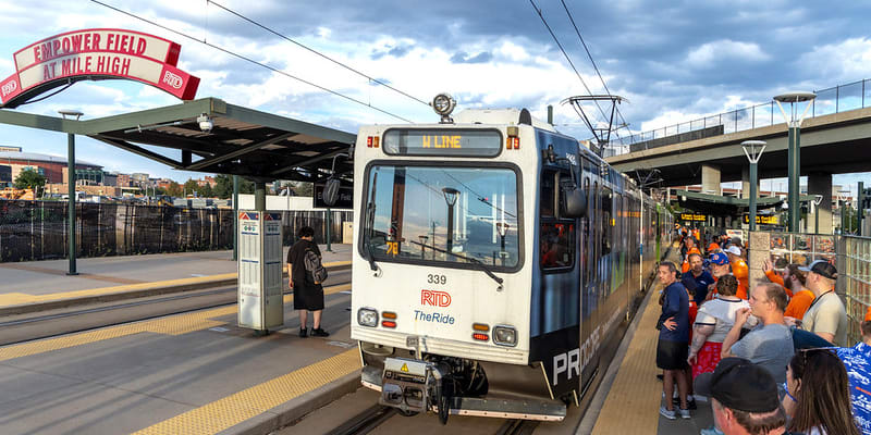 A photo of a W Line train at Empower Field at Mile High Station