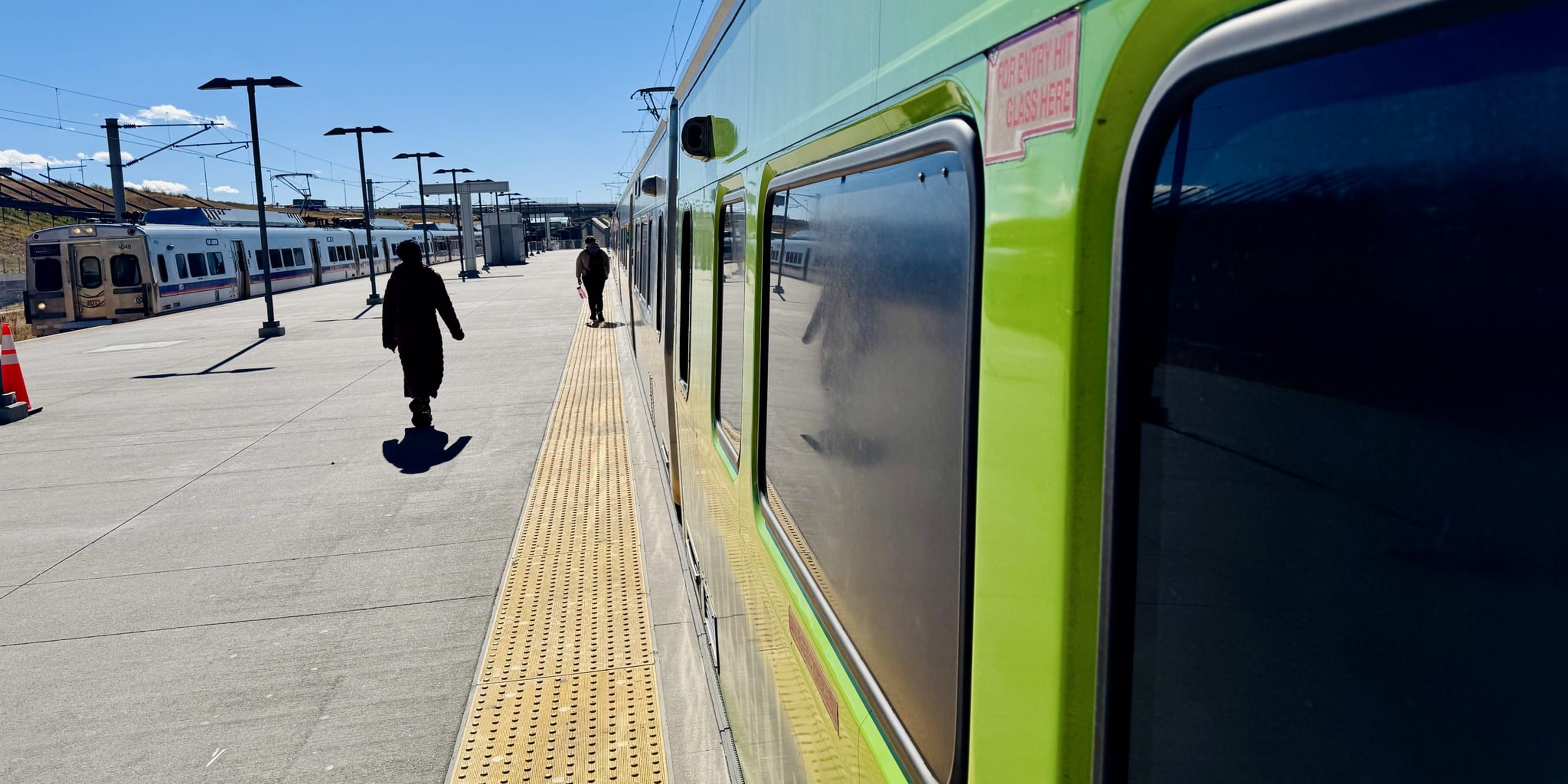 An RTD customer boards an A Line train at the Denver Airport Station on Oct. 28, 2025.