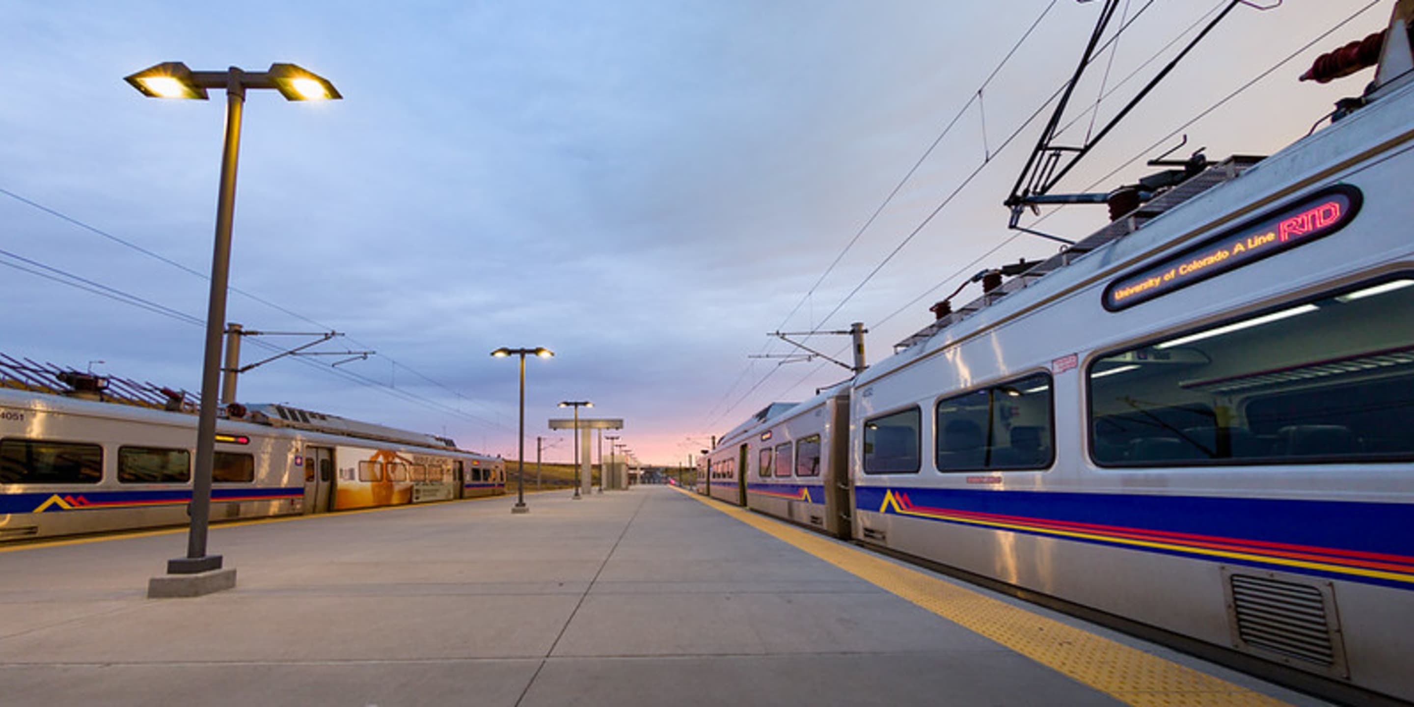 A photo of two trains at Denver Airport Station