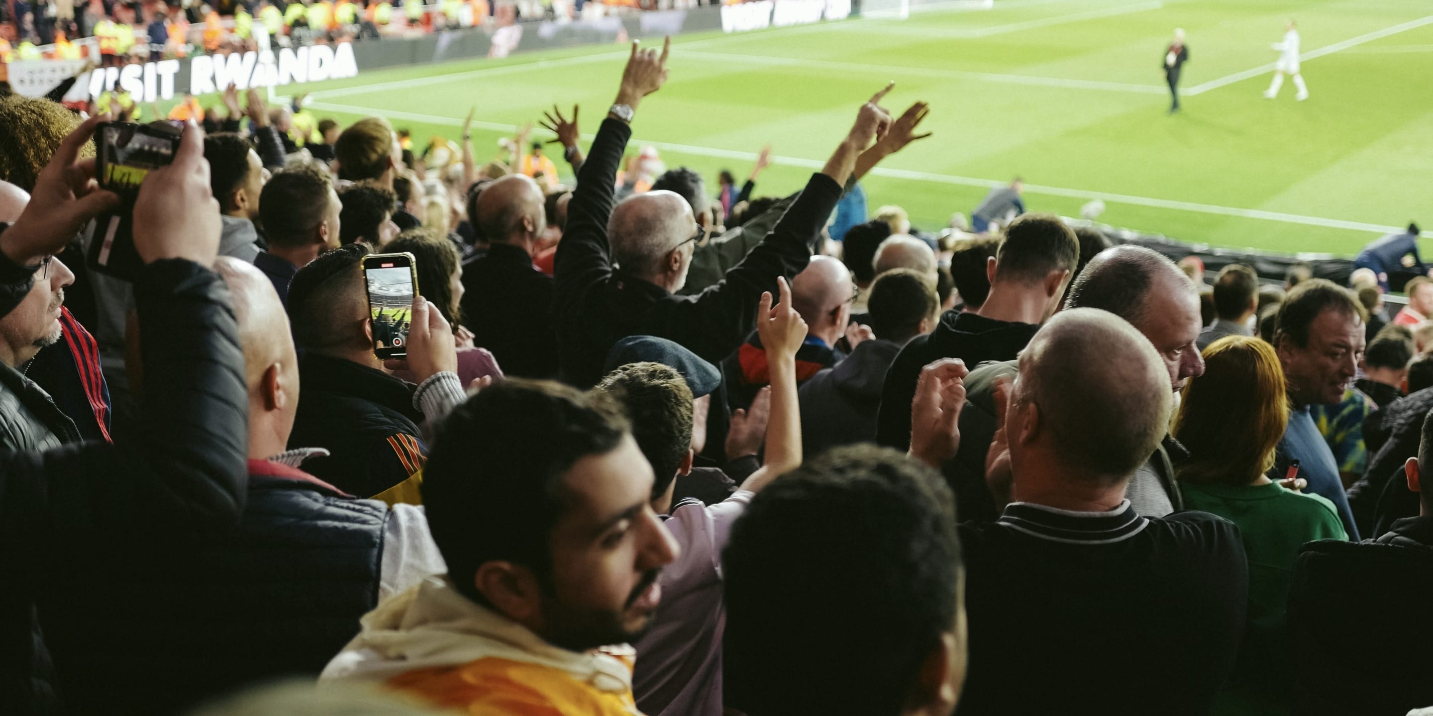 A photo of people watching a soccer match