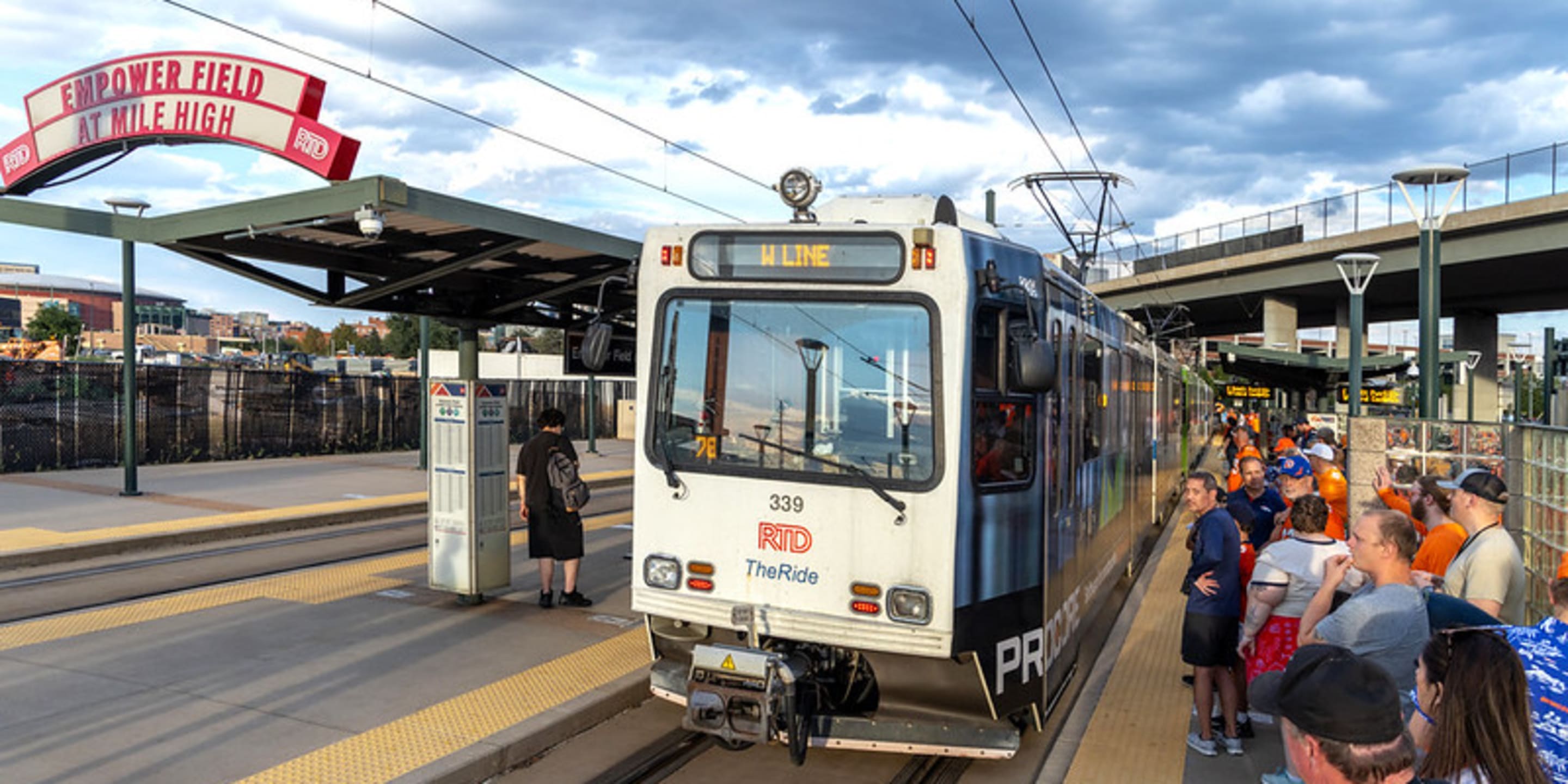 A photo of a W Line train at Empower Field at Mile High Station