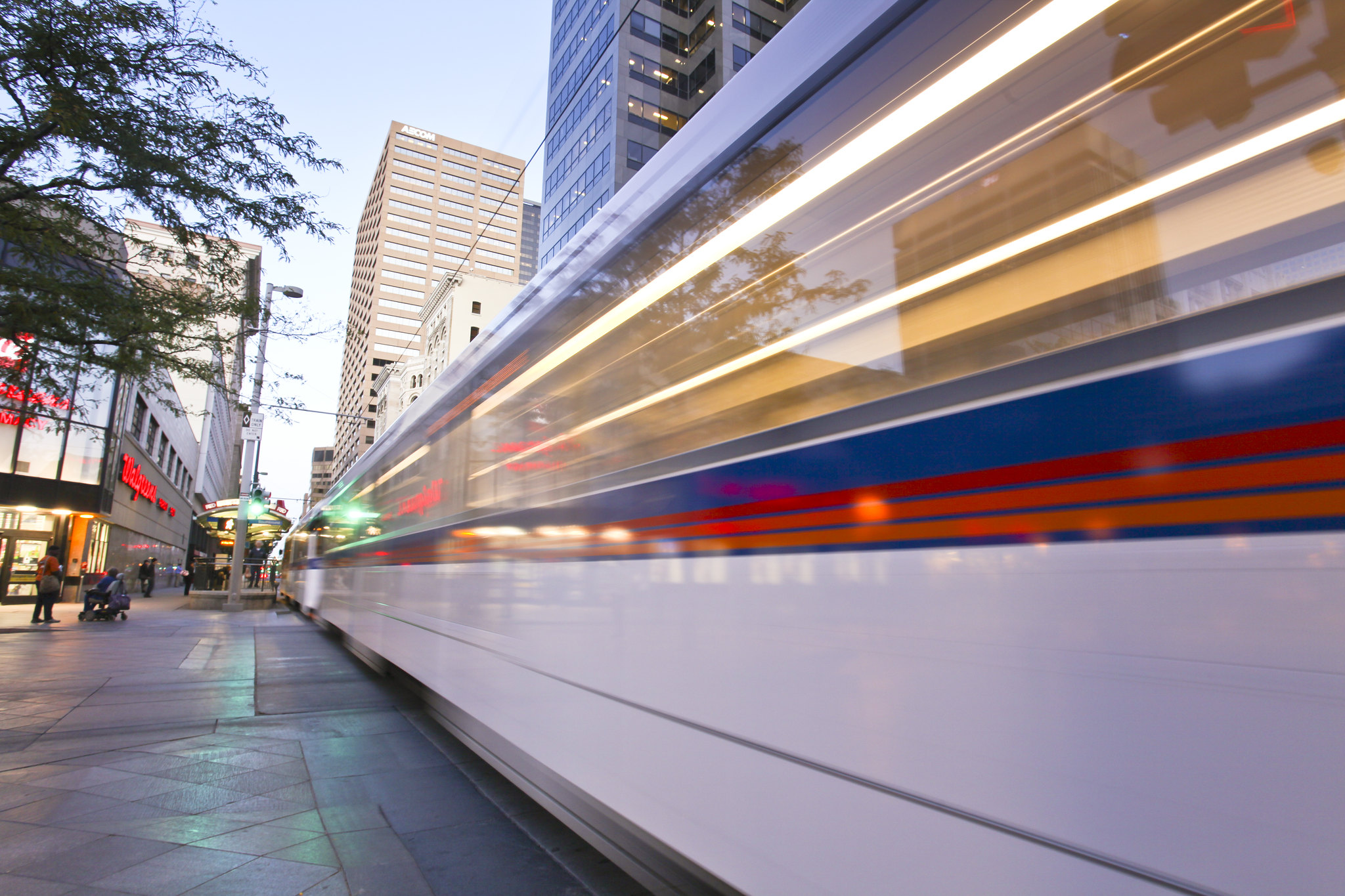 Person biking past the D Line on the track in downtown Denver