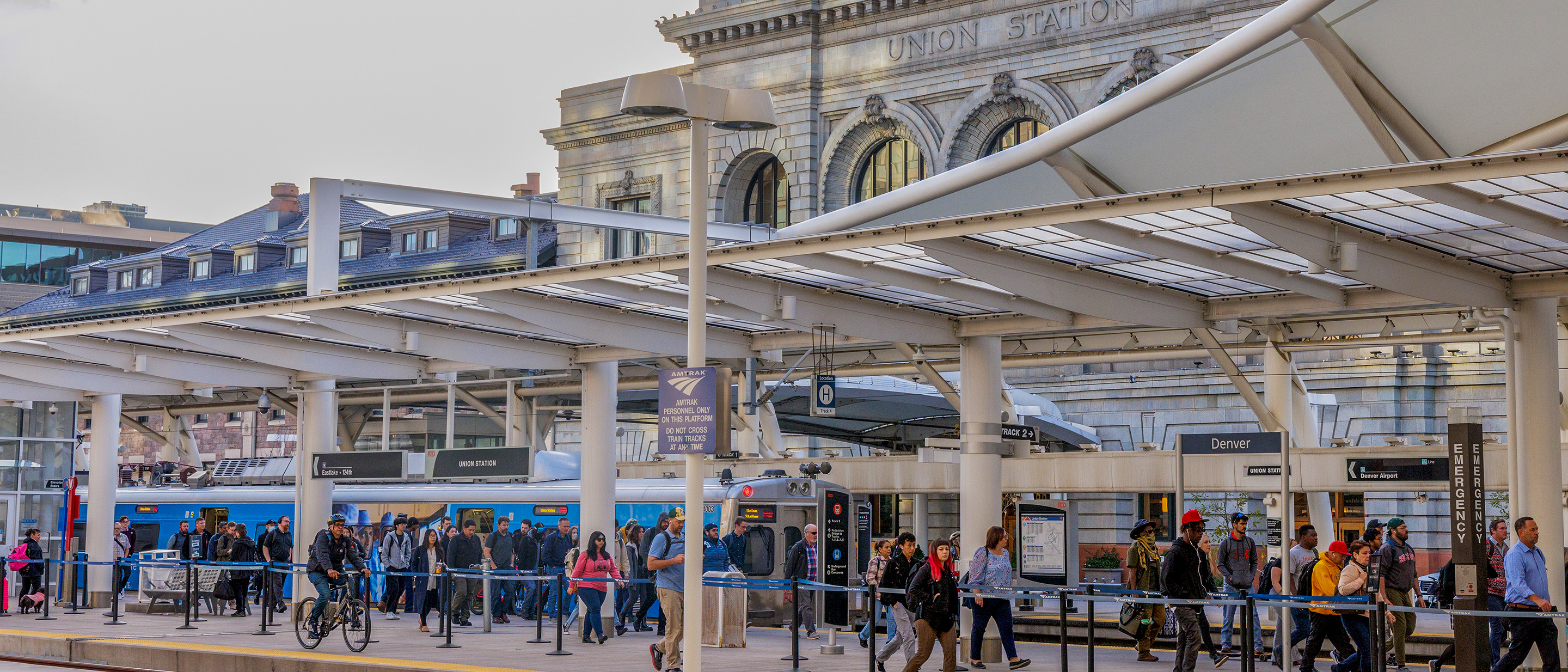 Photo of people walking outside near the commuter rail line at Union Station