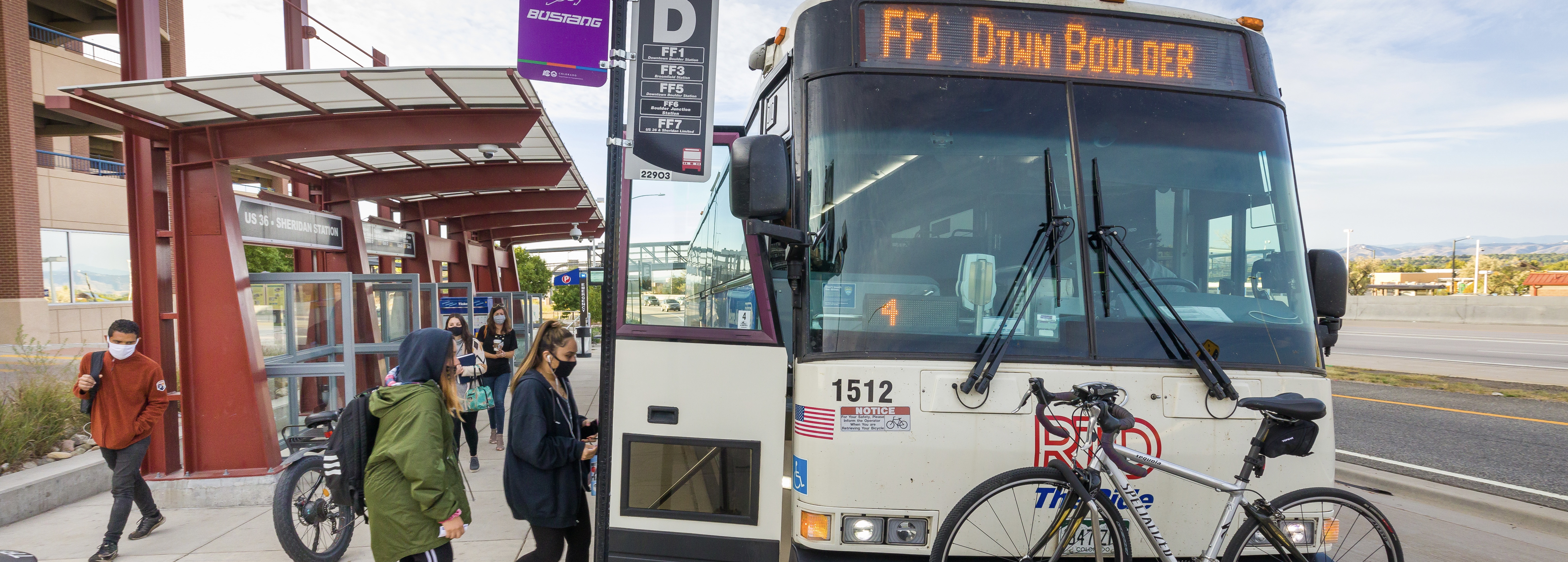 Customers boarding the Flatiron Flyer bus headed for downtown Boulder