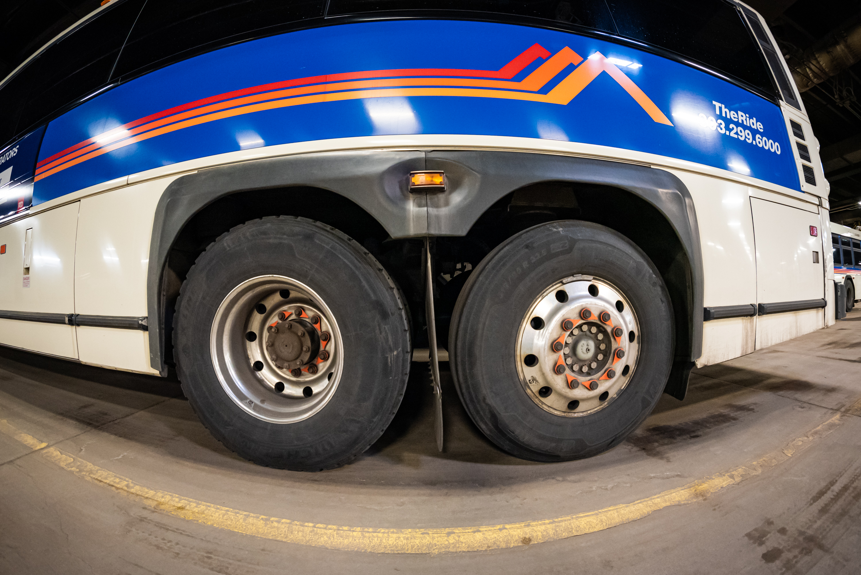 Photo of an RTD bus with wheels up close