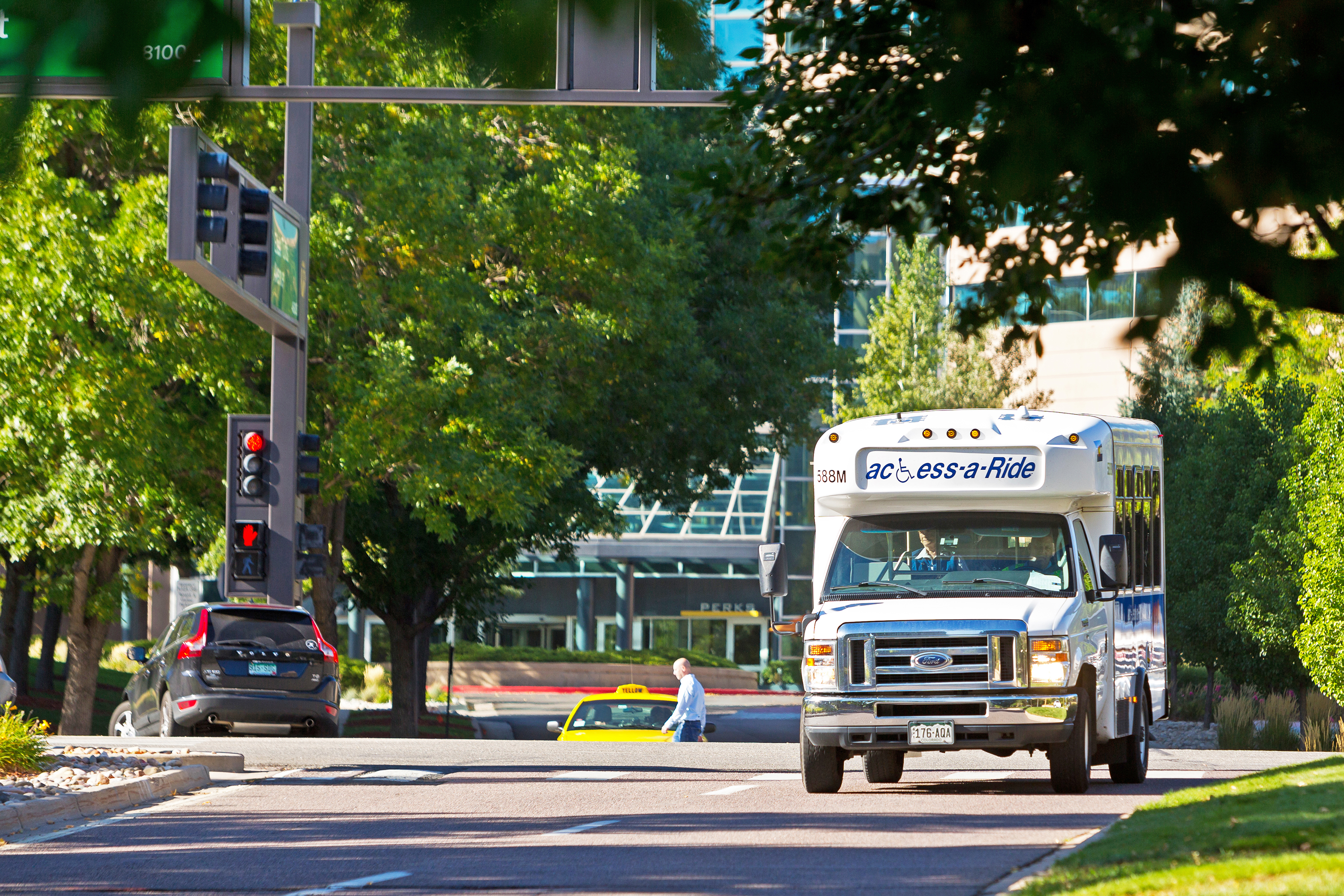 A customer using a wheelchair exits the bus at Civic Center Station